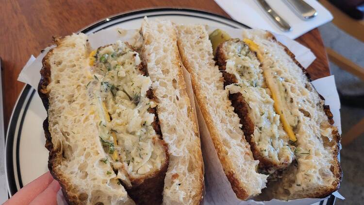 A fish sandwich cut in half