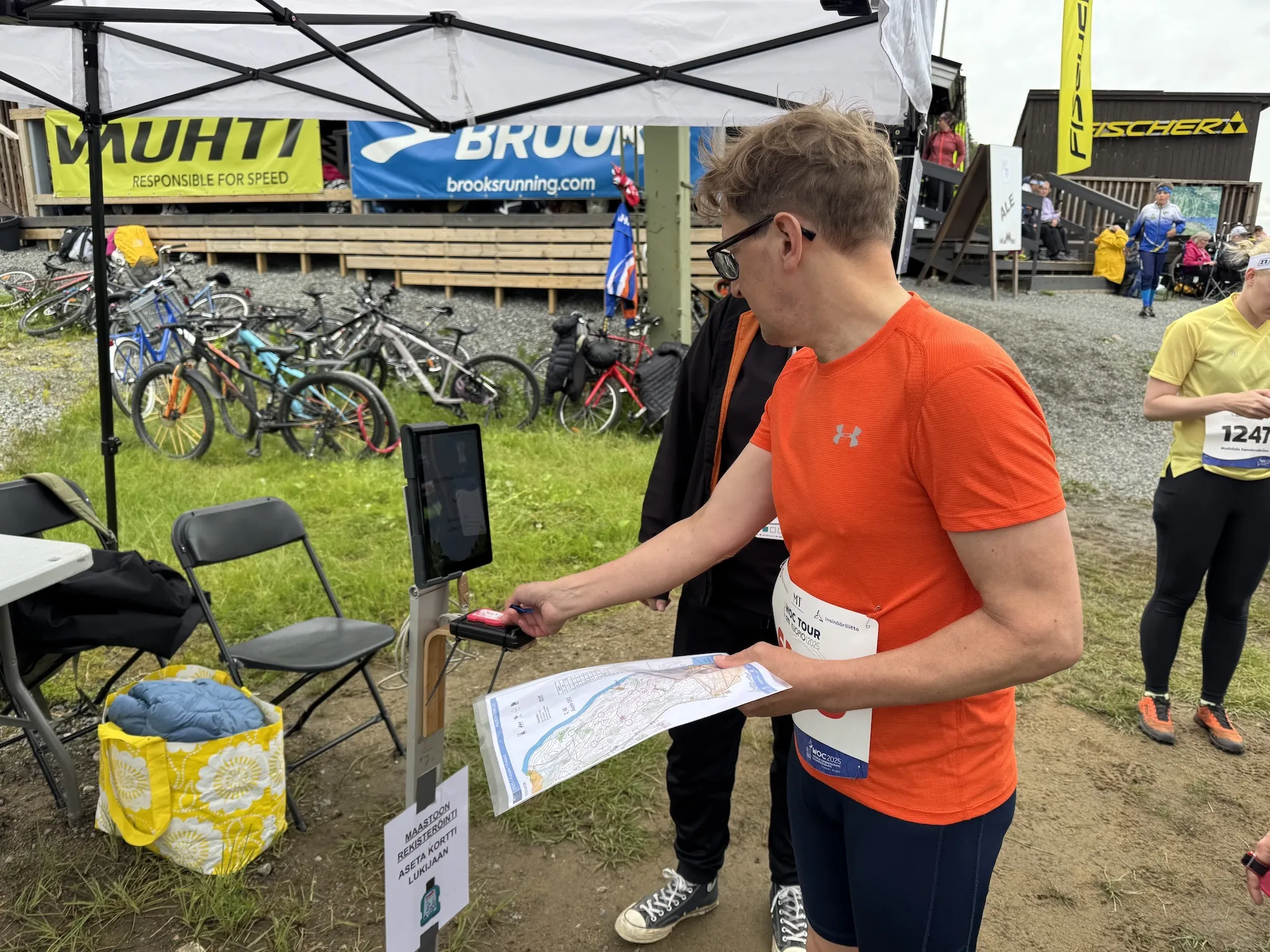 A man at his first checkpoint before orienteering