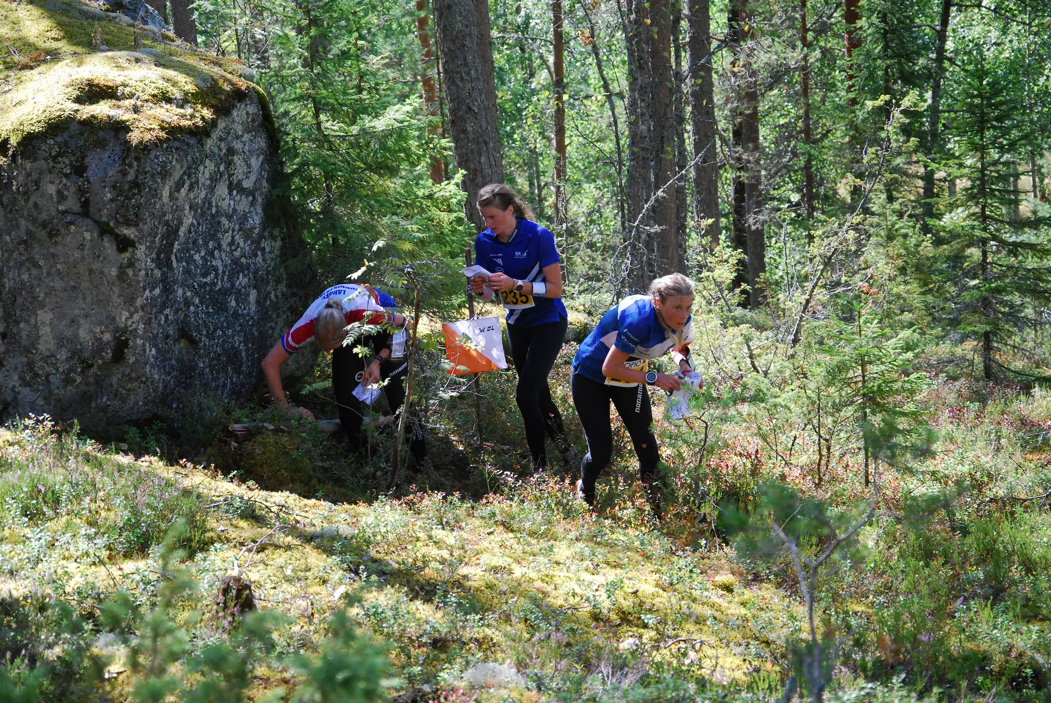 Orienteering participants in a forest