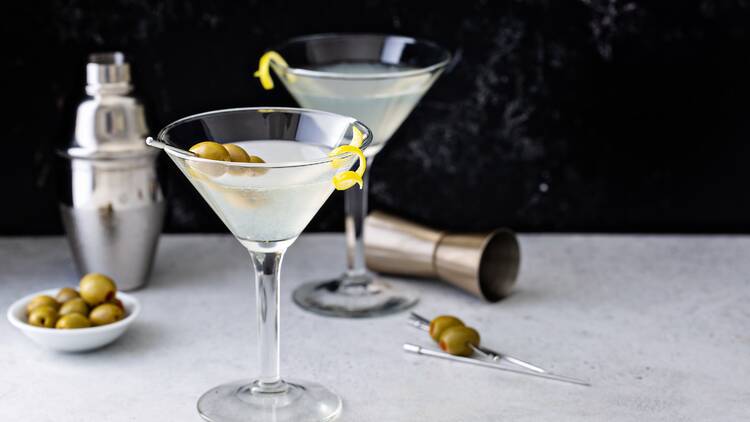Classic lemon drop martini with olives and a lemon twist