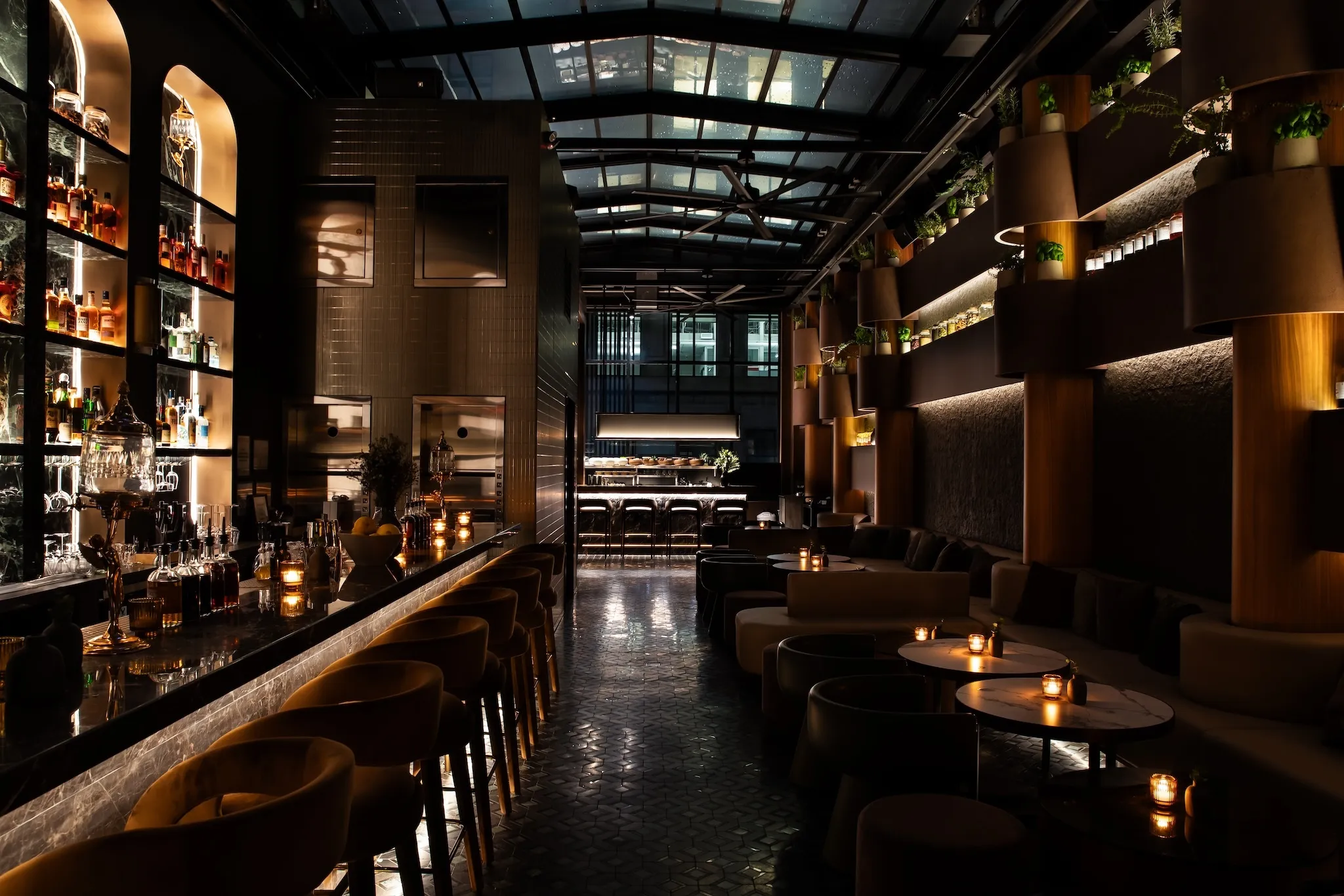 BarChef with an illuminated bar on the left and a retractable glass ceiling