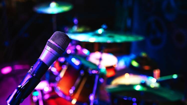 Karaoke microphone onstage with band equipment