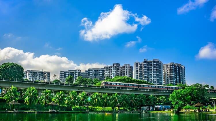 MRT Train passing with The Estuary codo in the background, Yishun Town, Singpore.