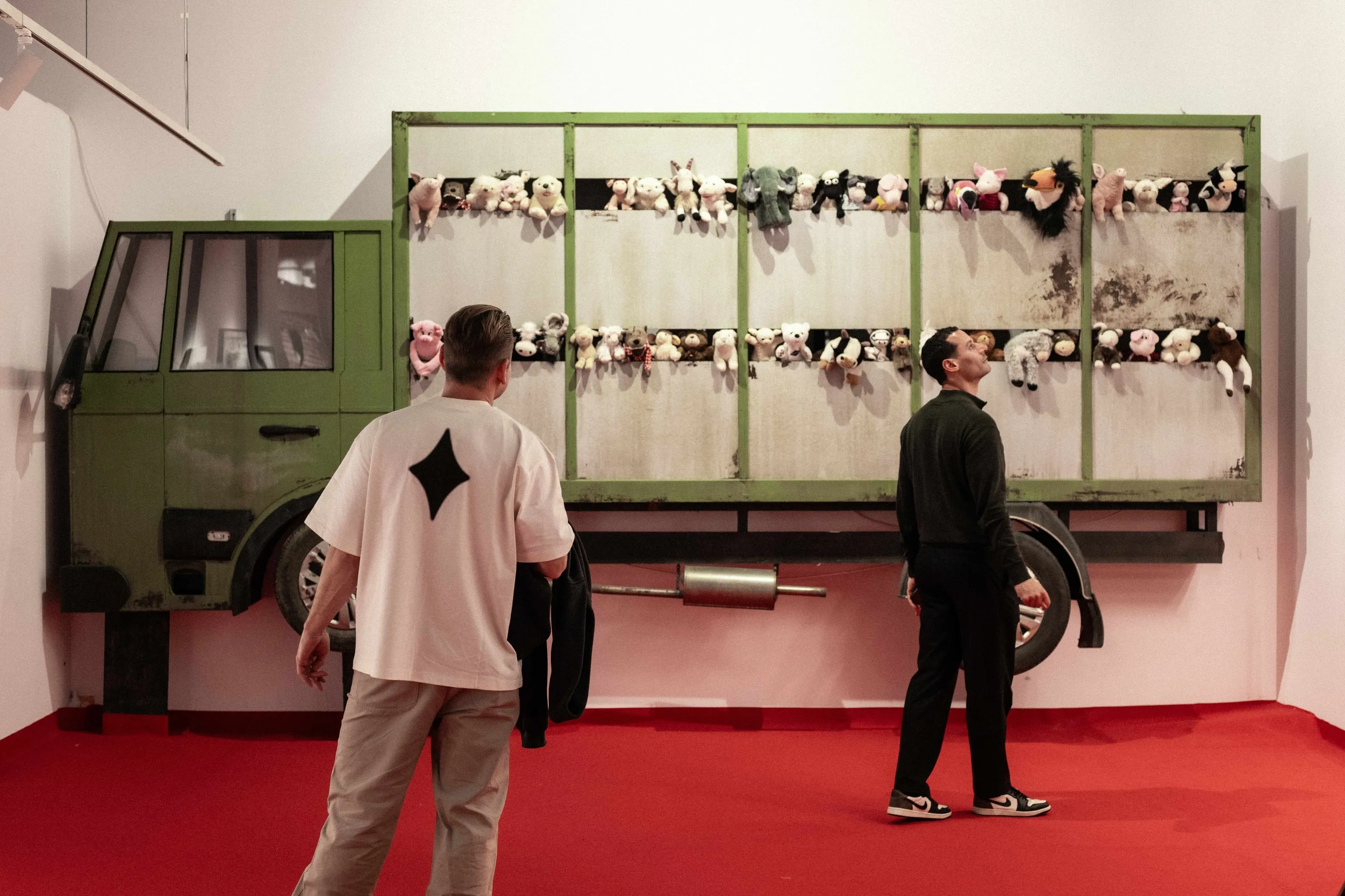 Two men looking at artwork
