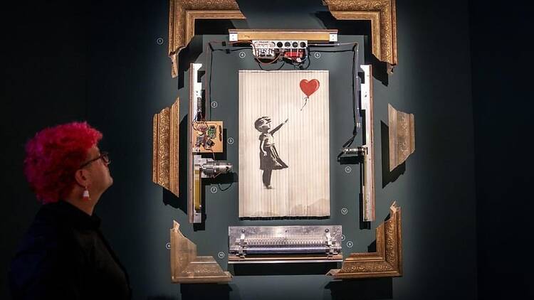 Banksy artwork on black ball