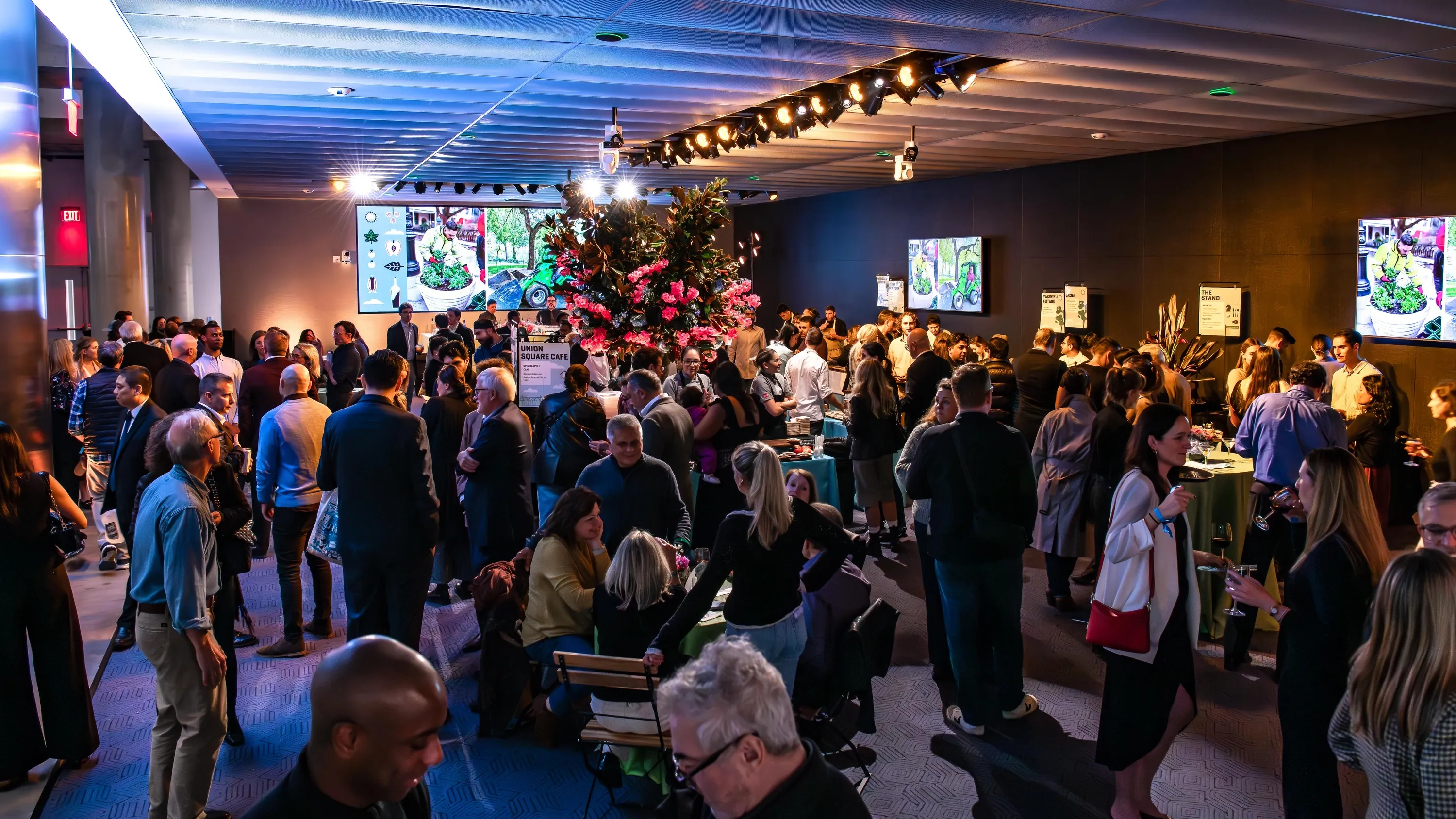 People pack into a venue for a food festival.
