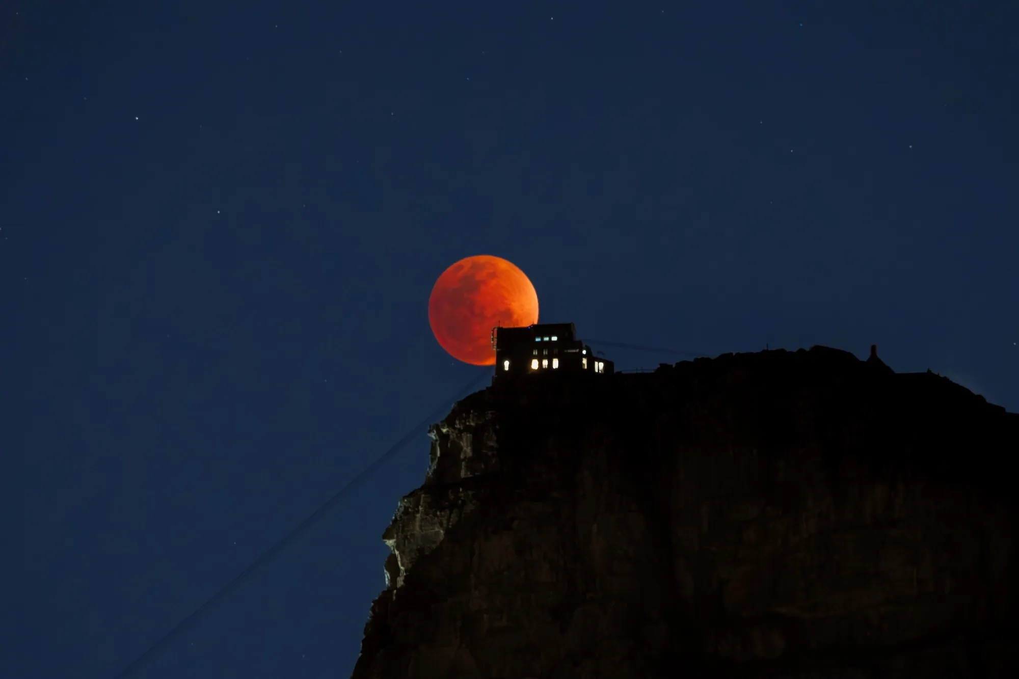 The Full Blood Moon rose in peak illumination for just a few brief minutes,