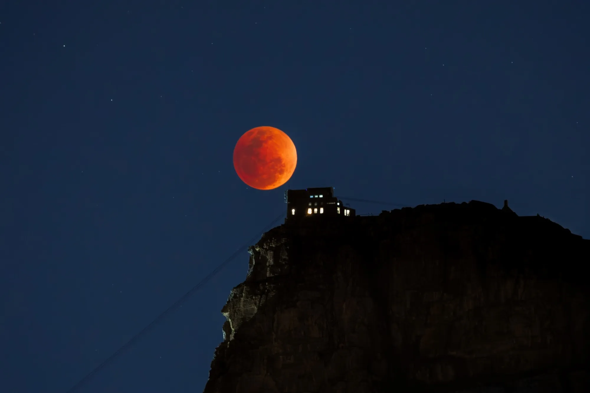 The Full Blood Moon rose in peak illumination for just a few brief minutes,