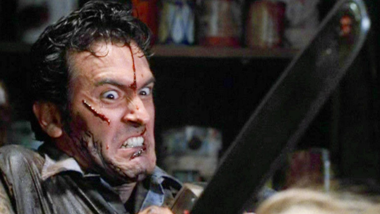 The Evil Dead Bruce Campbell holding a chainsaw in The Evil Dead.