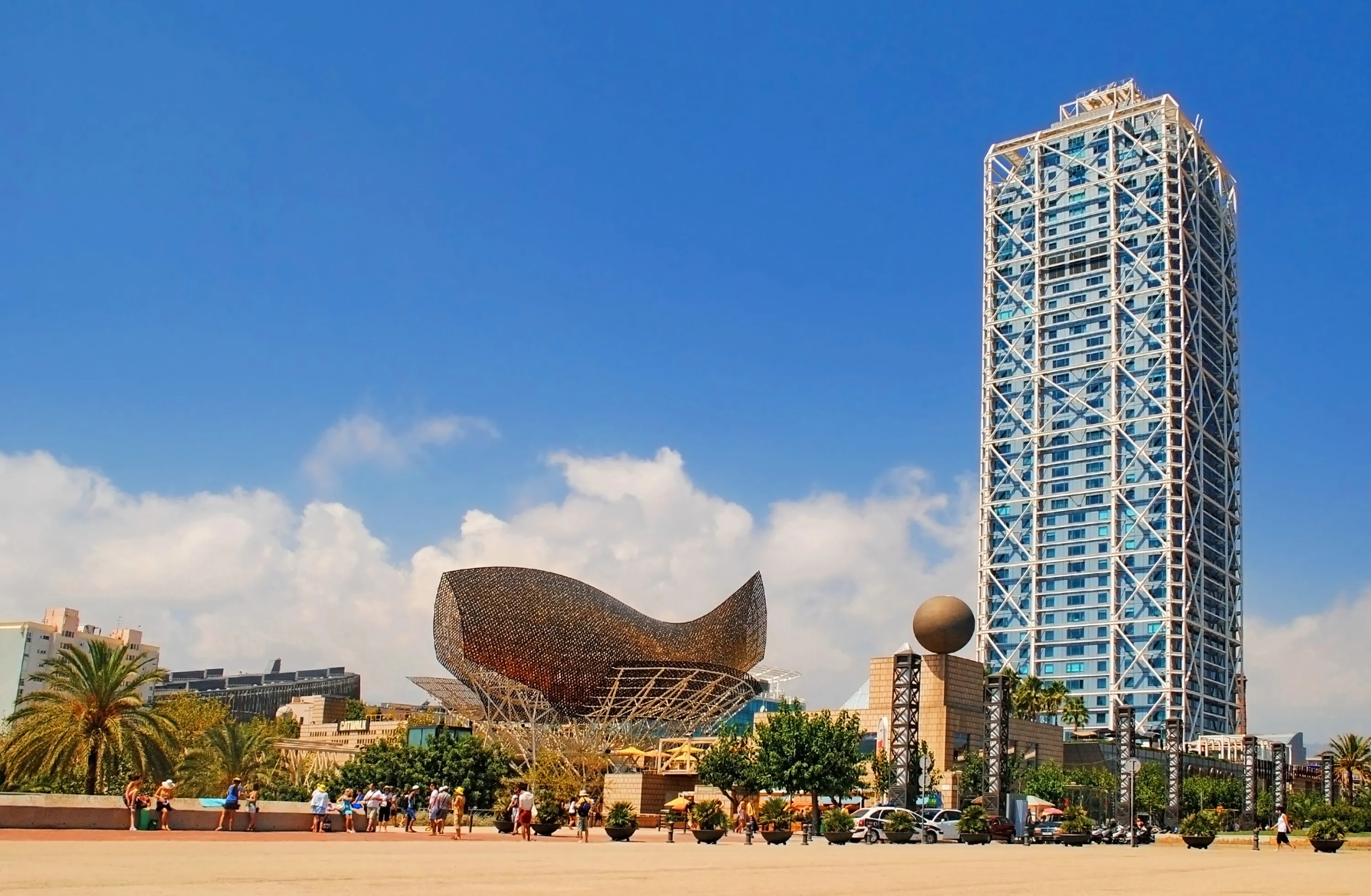 Hotel Arts and Peix sculpture in Port Olimpic on August 12, 2011 in Barcelona, Spain. The sculpture designed by Frank Ghery.