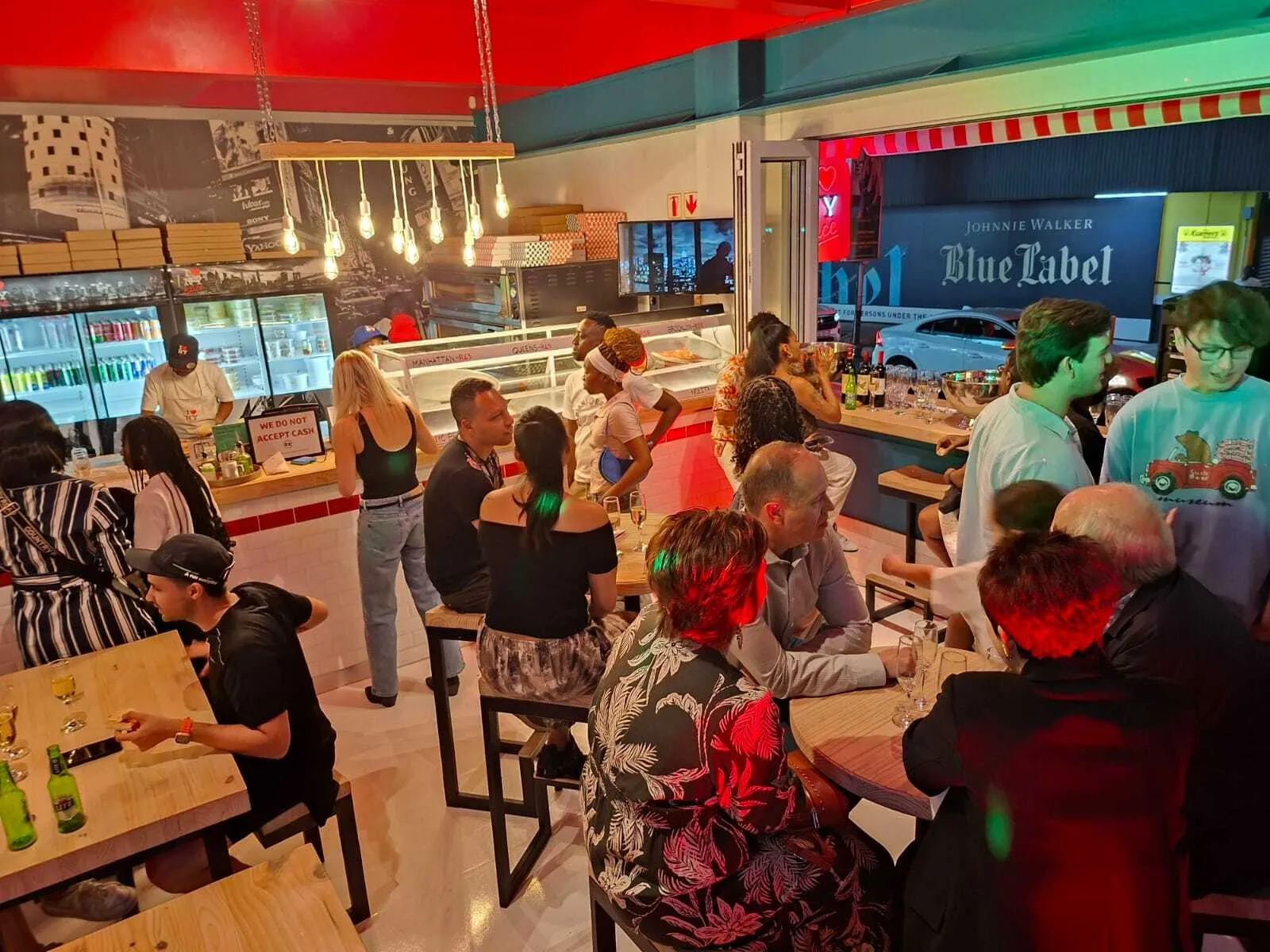 People dining at NY Slice pizza in Joburg