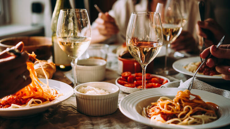 A pasta dinner with white wine
