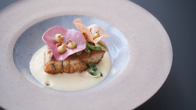Fish with garnish in bowl