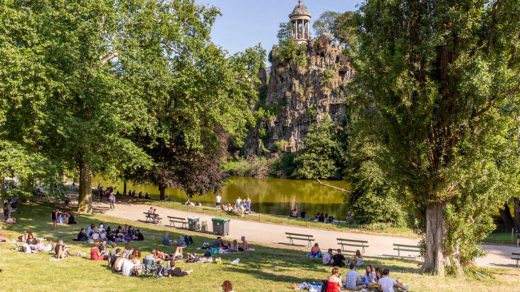 People hanging out in a park in Paris