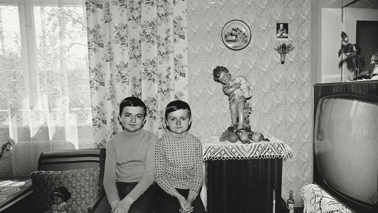 Black and white photograph of two young boys sat together in a living room from Sociological Record © Zofia Rydet, Black and white photograph of two young boys sat together in a living room from Sociological Record © Zofia Rydet,