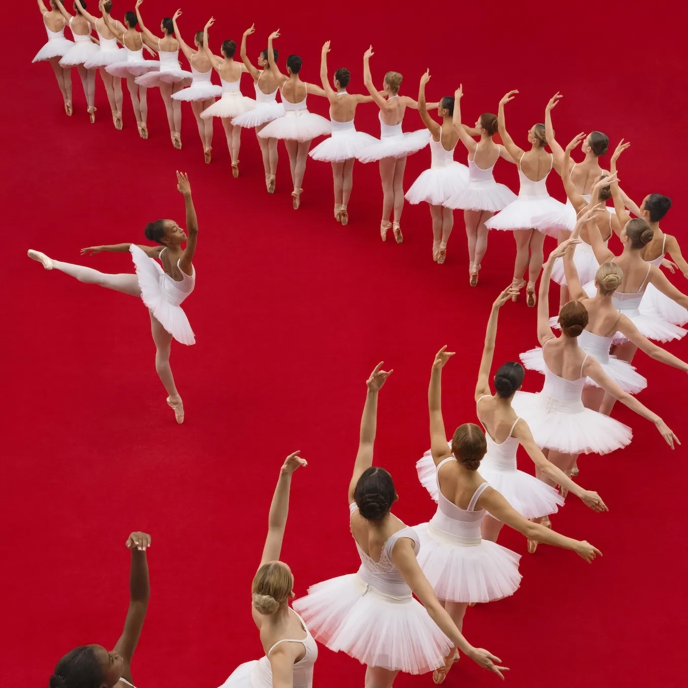 Ballerinas formed into a right angle with one ballerina centered