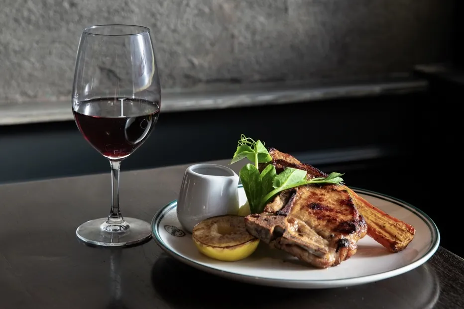 Pub meal and glass of red wine.