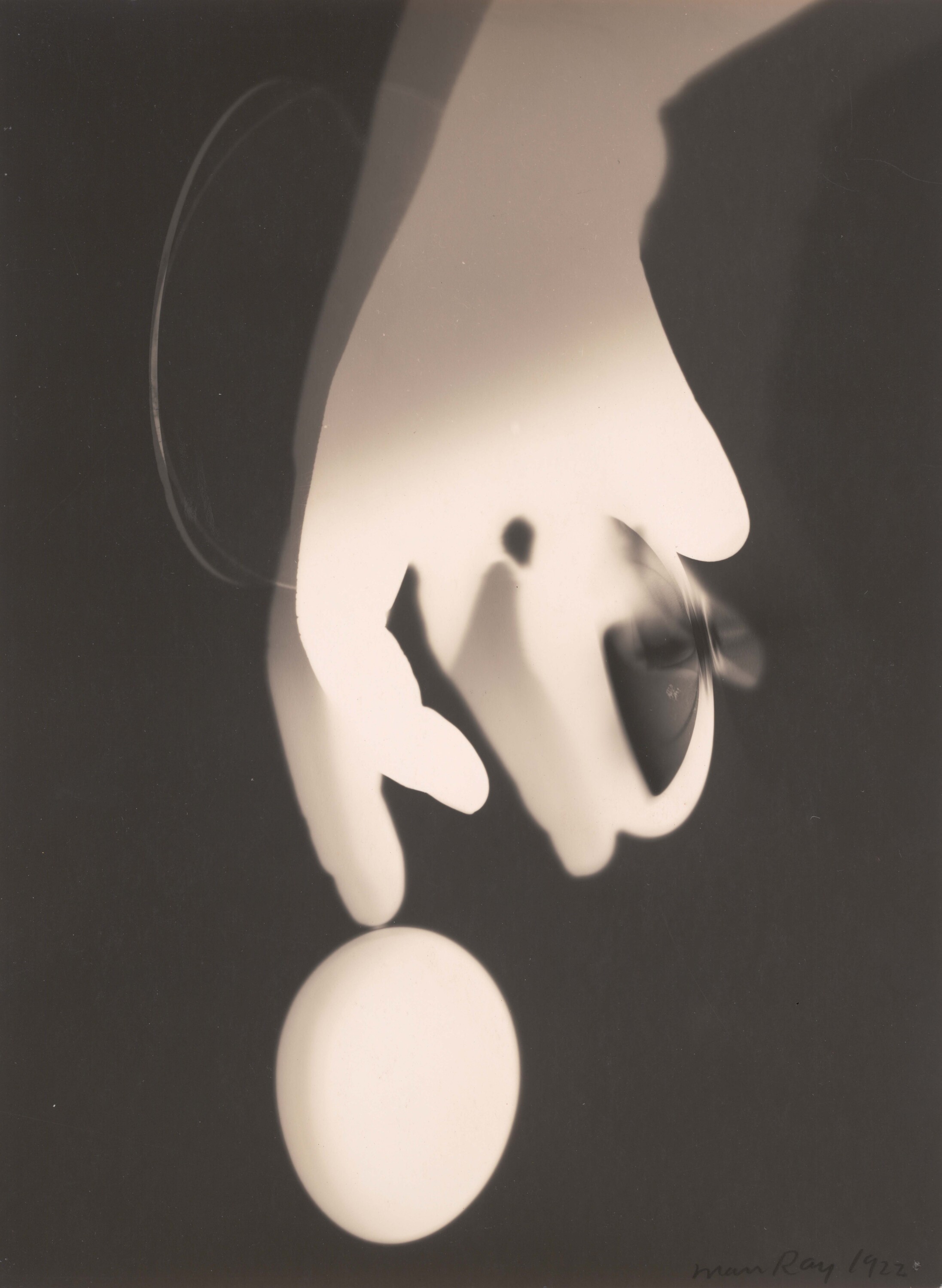 An abstract black-and-white rayograph.