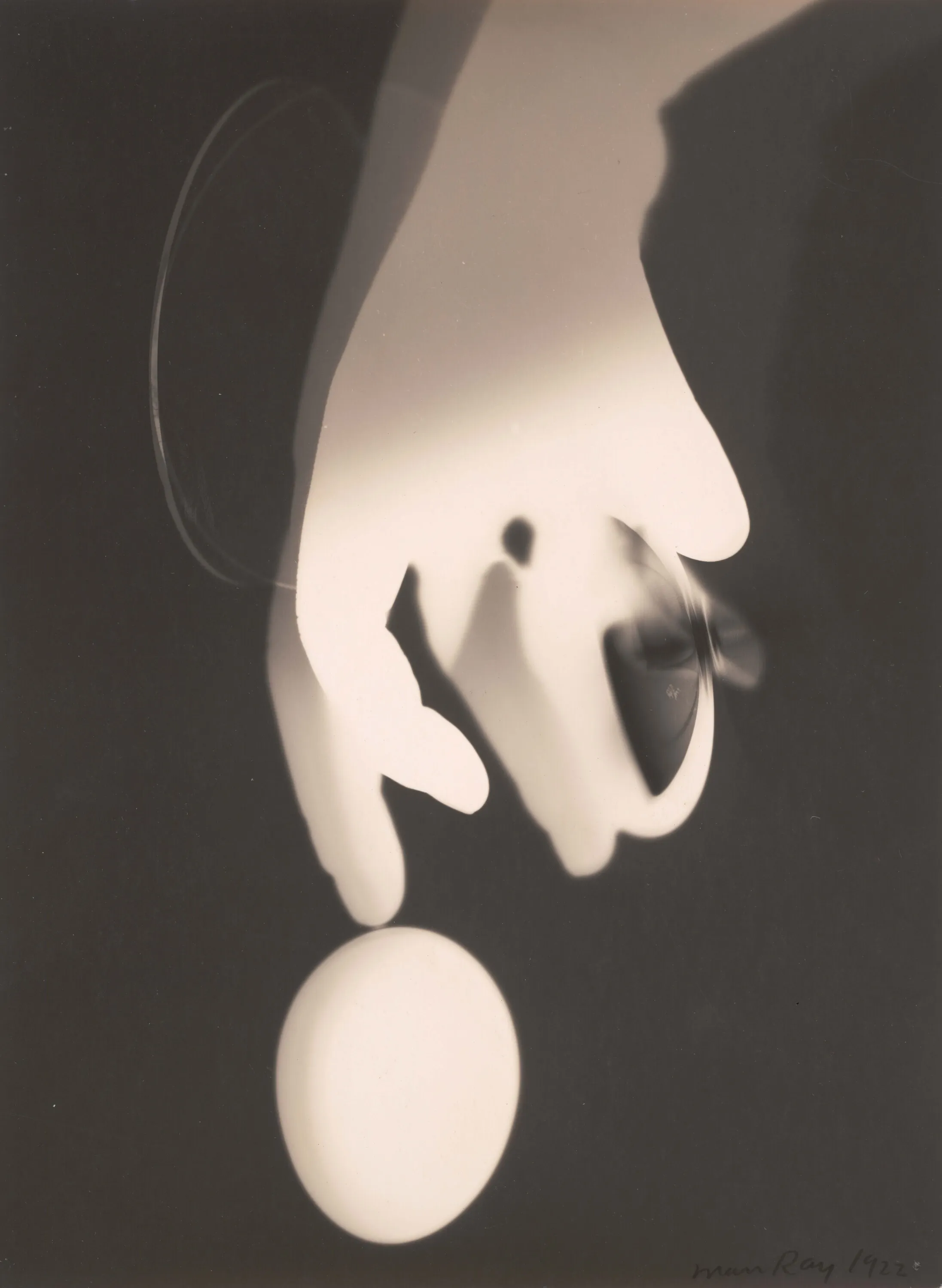 An abstract black-and-white rayograph.