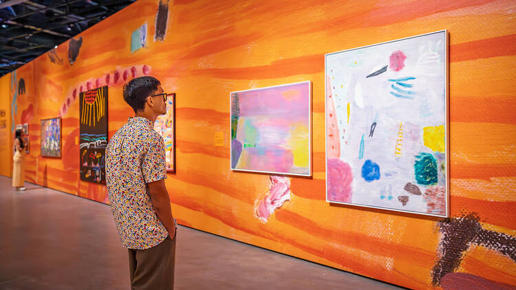 Art gallery with bright orange walls