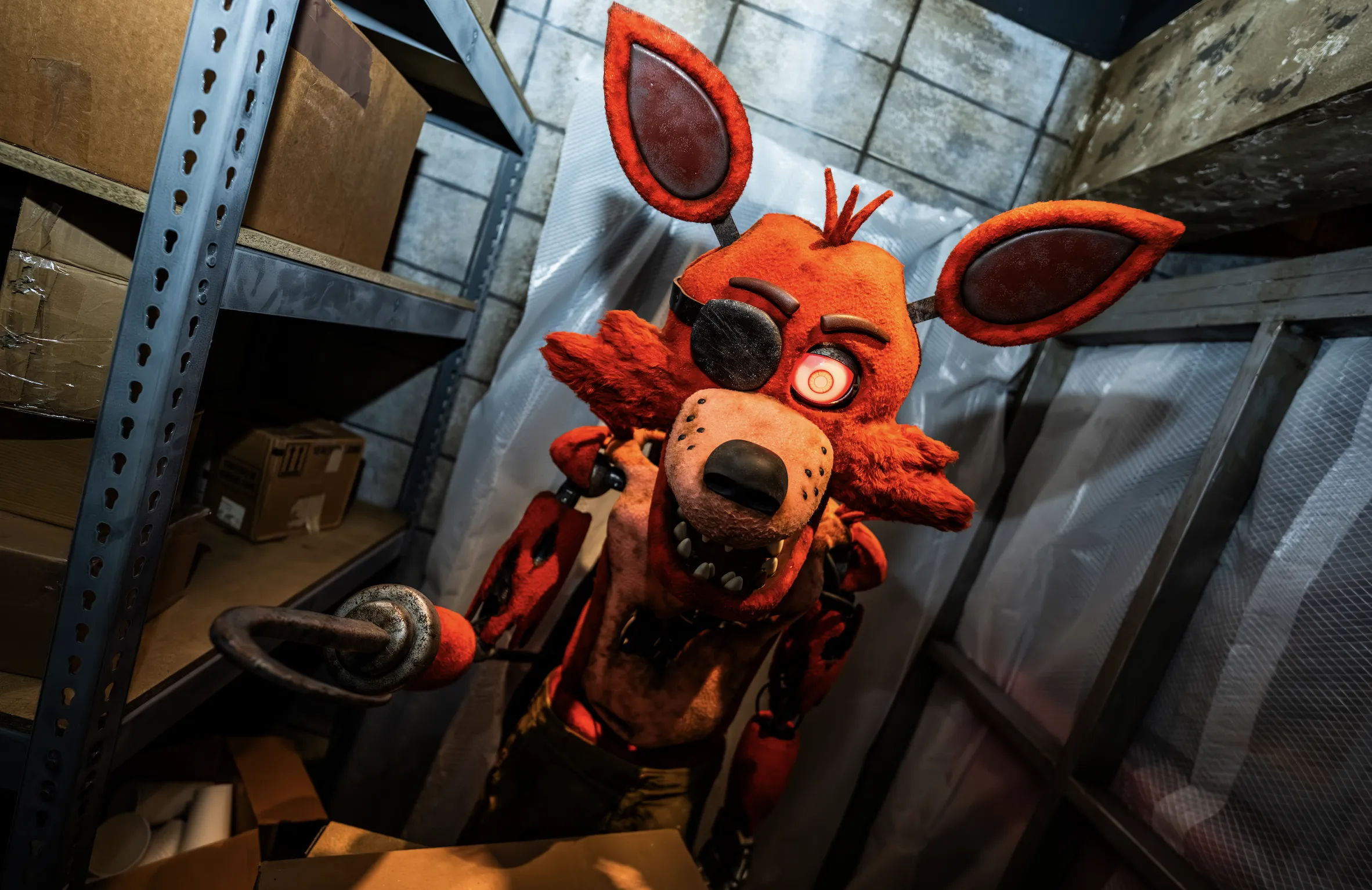 A human-size animatronic fox with a hook for a hand.