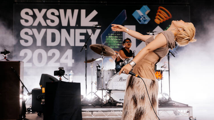 Singer dancing on the SXSW stage