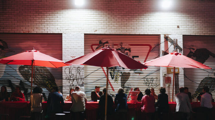 People standing outside a bar