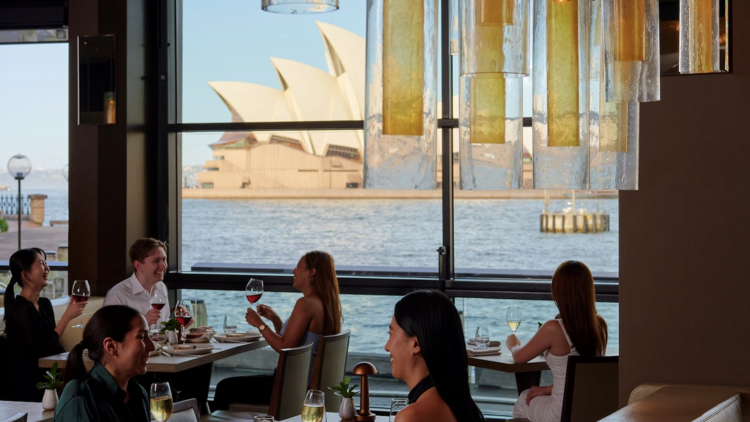 People dining with views of Sydney Opera House