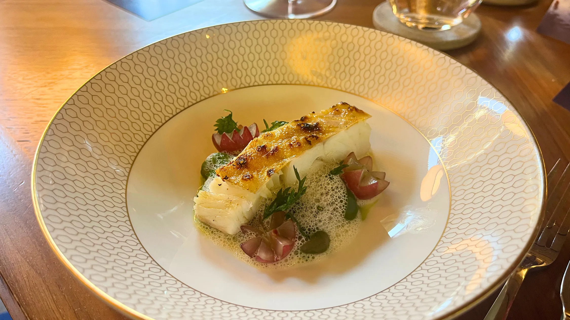 Fish with grapes and foam