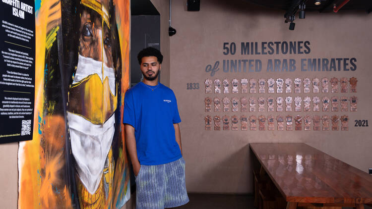 Graffiti Artist Isl4m in the Market at the Emirati corner
