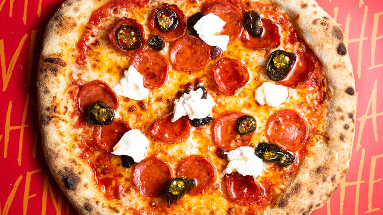 A Pizza Punks pizza with pepperoni, hot honey, and buratta