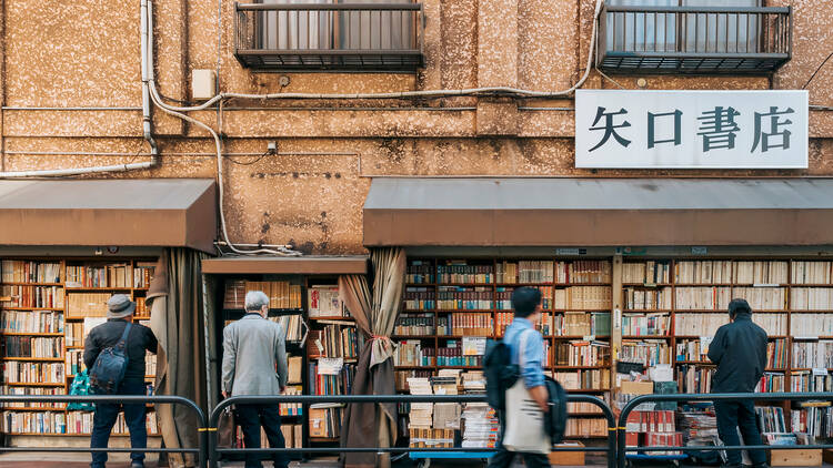 People walking in Jimbocho, Tokyo, famous second-hand book shop area 