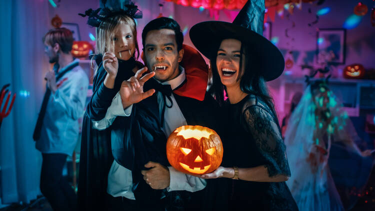 Family dressed up in Halloween costumes