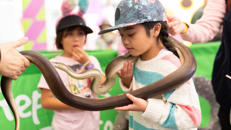 Girl holding a snake