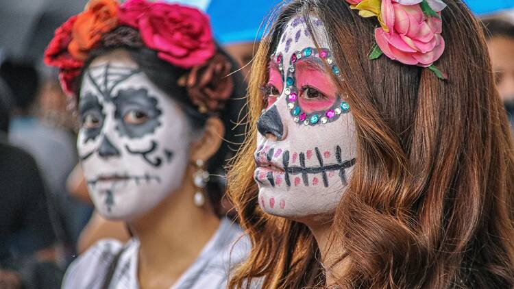 Attendees at a Día de Los Muertos parade