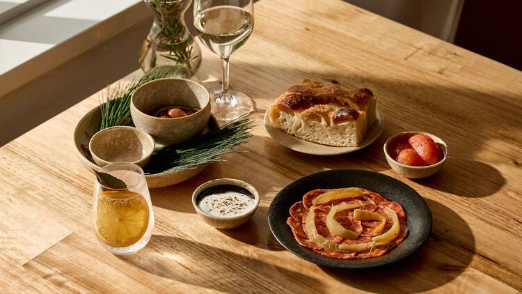 Spread of dishes on wood table