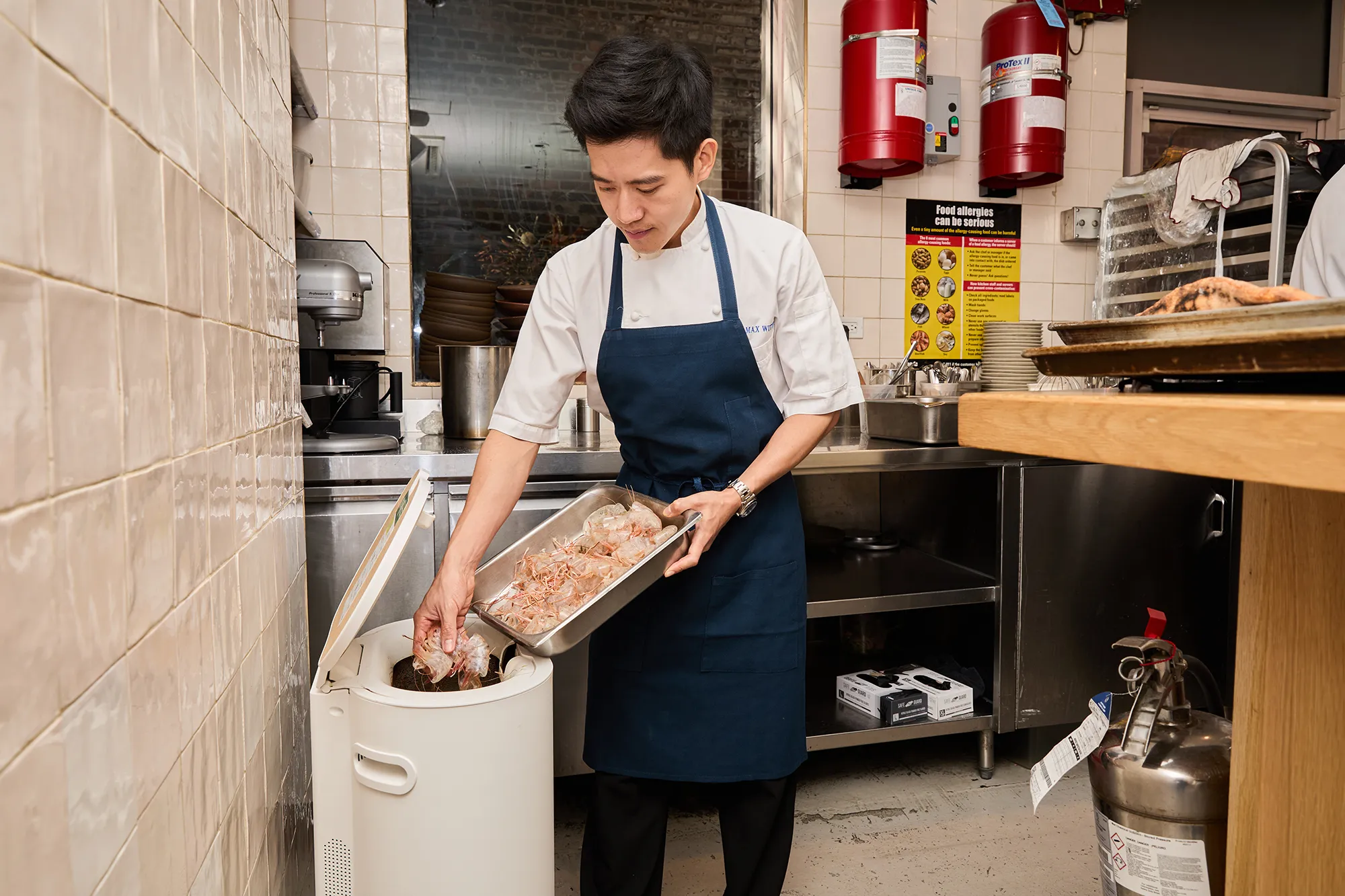 food scraps going into a mill