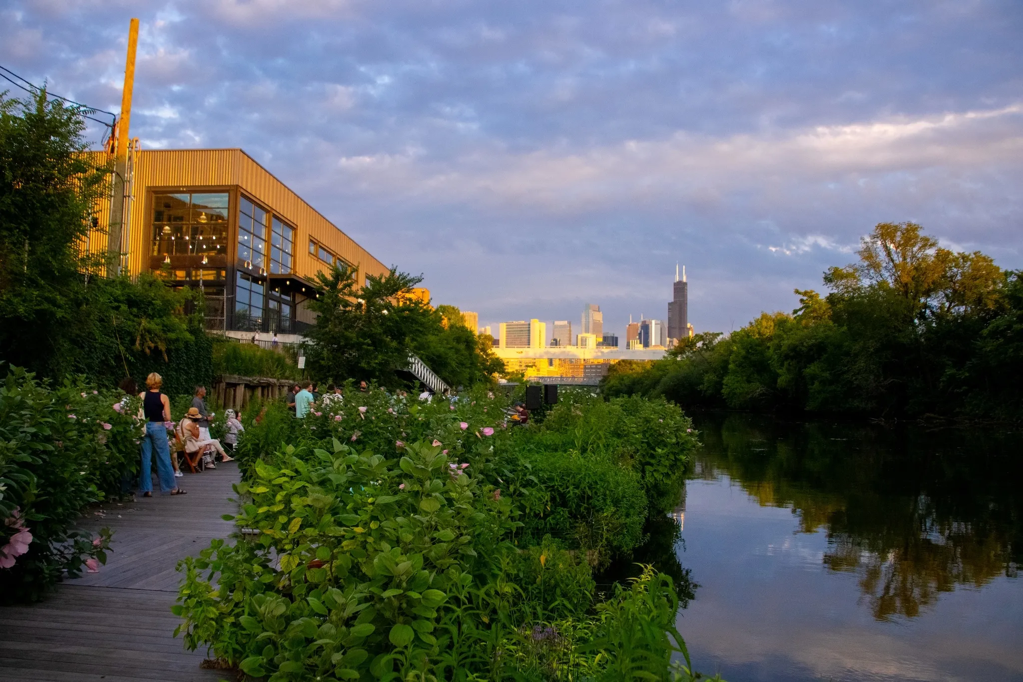 Visitors admire the water and greenery at the Wild Mile.