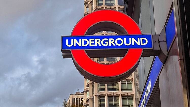 London Underground sign at Tottenham Court Road station in London