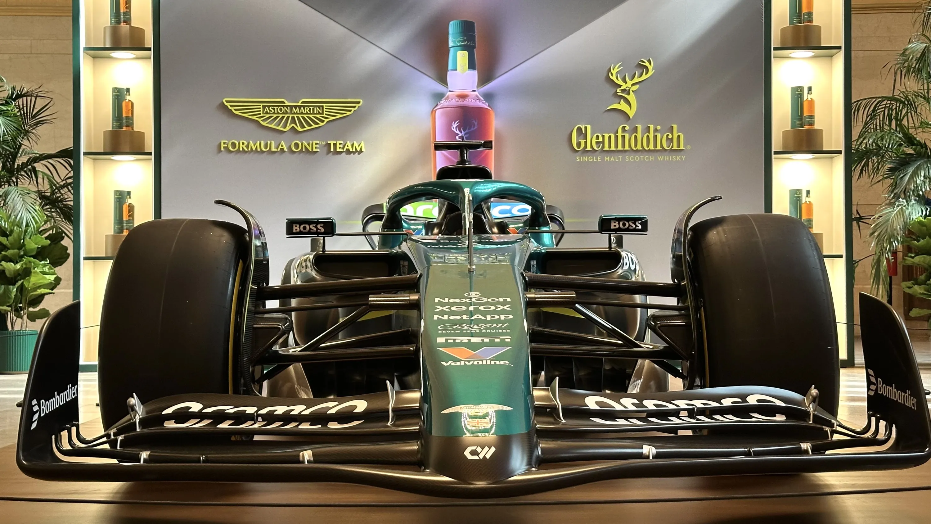 A close-up of a green Formula 1 racecar.
