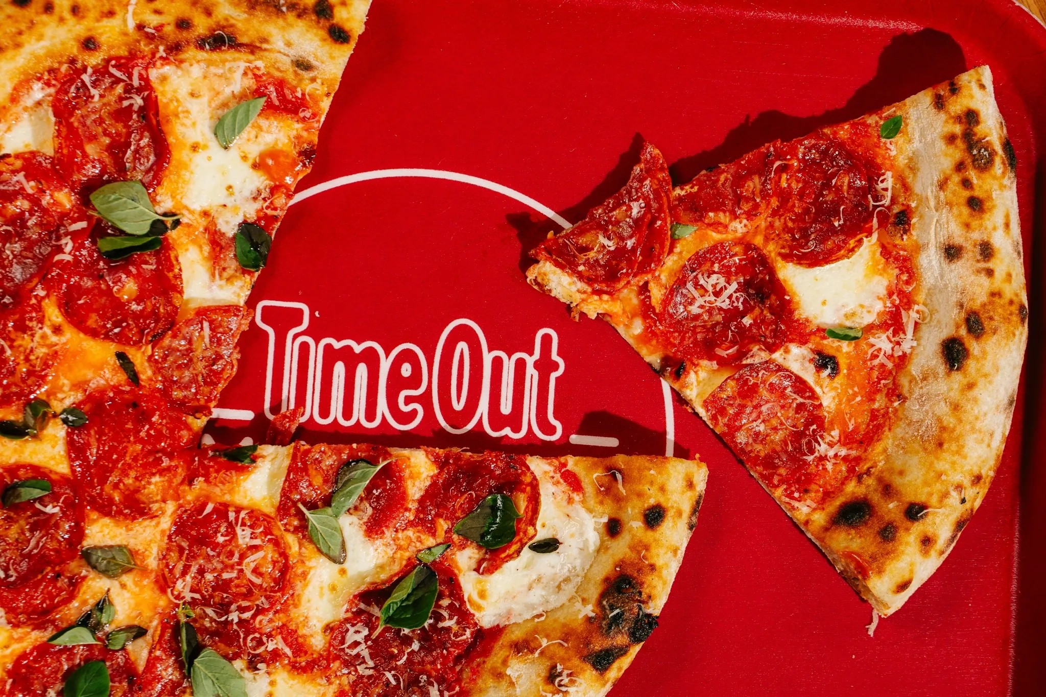 A slice of pizza on a tray that says time out