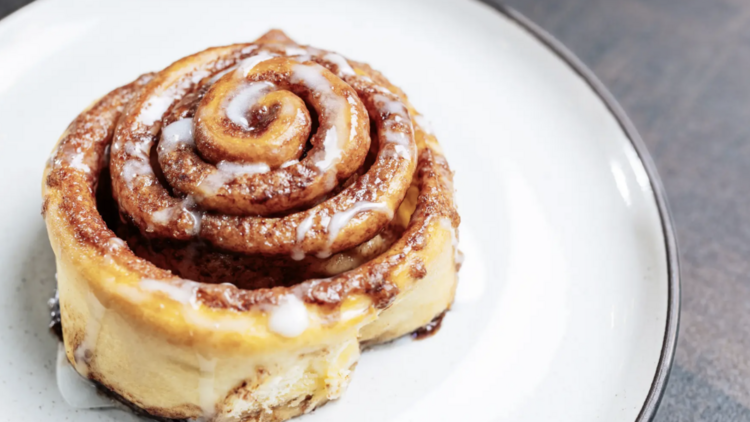 Cinnamon roll on a white plate