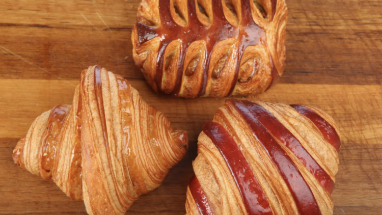 Three Croissants on a wooden board