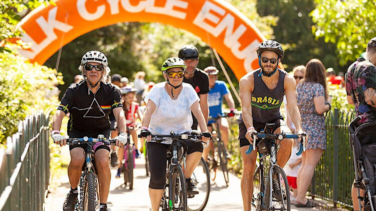 Three cyclists biking side by side on the Tour de Waltham Forest route