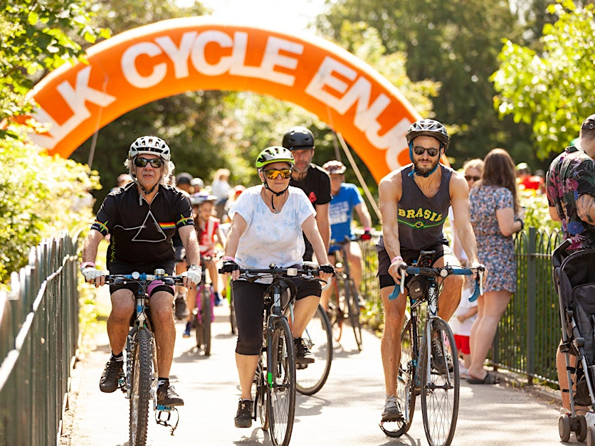Three cyclists biking side by side on the Tour de Waltham Forest route