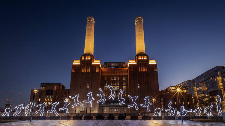 A building in Newcastle illuminated by jumping men