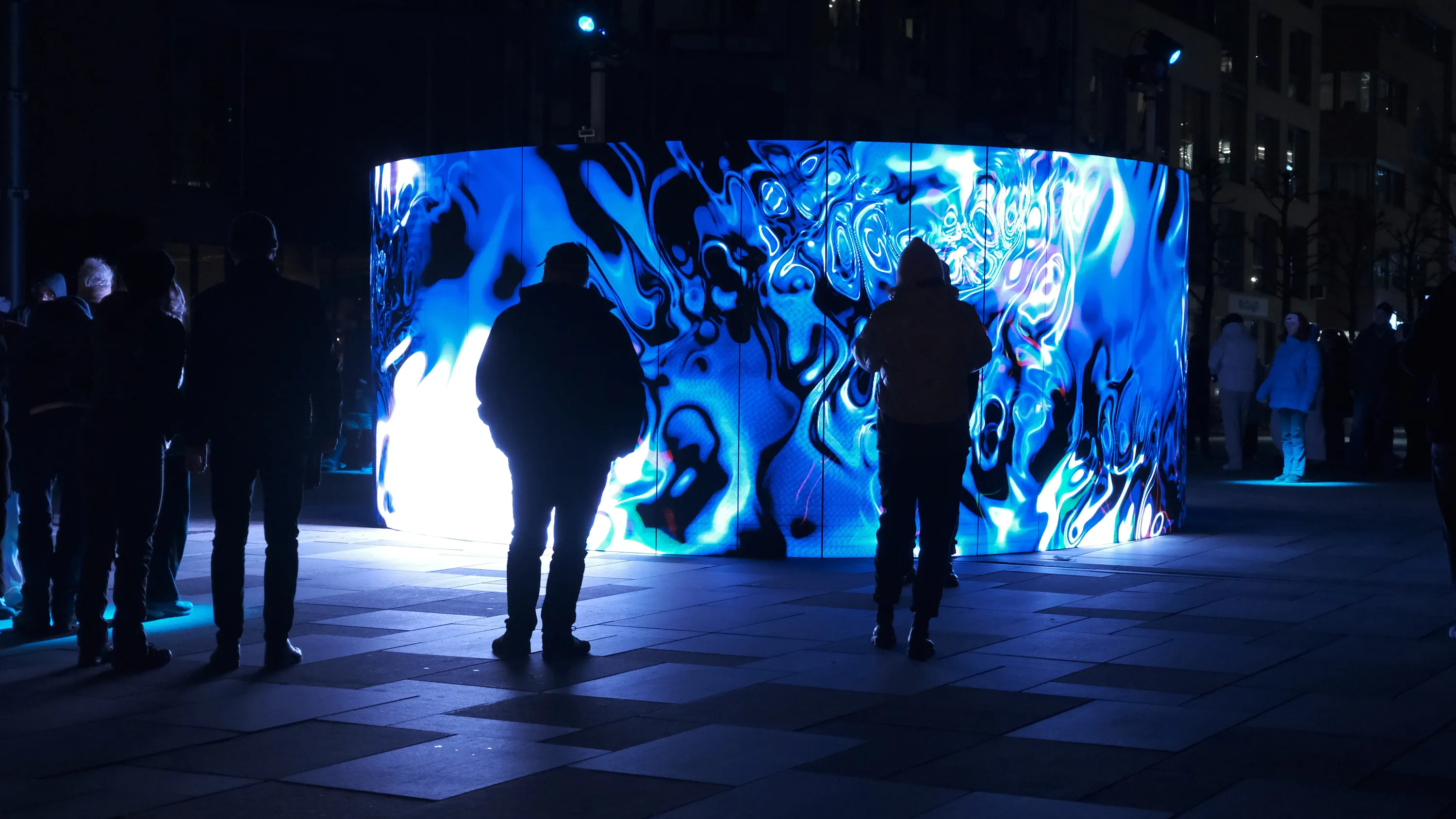 People standing in front of a light installation in Newcastle