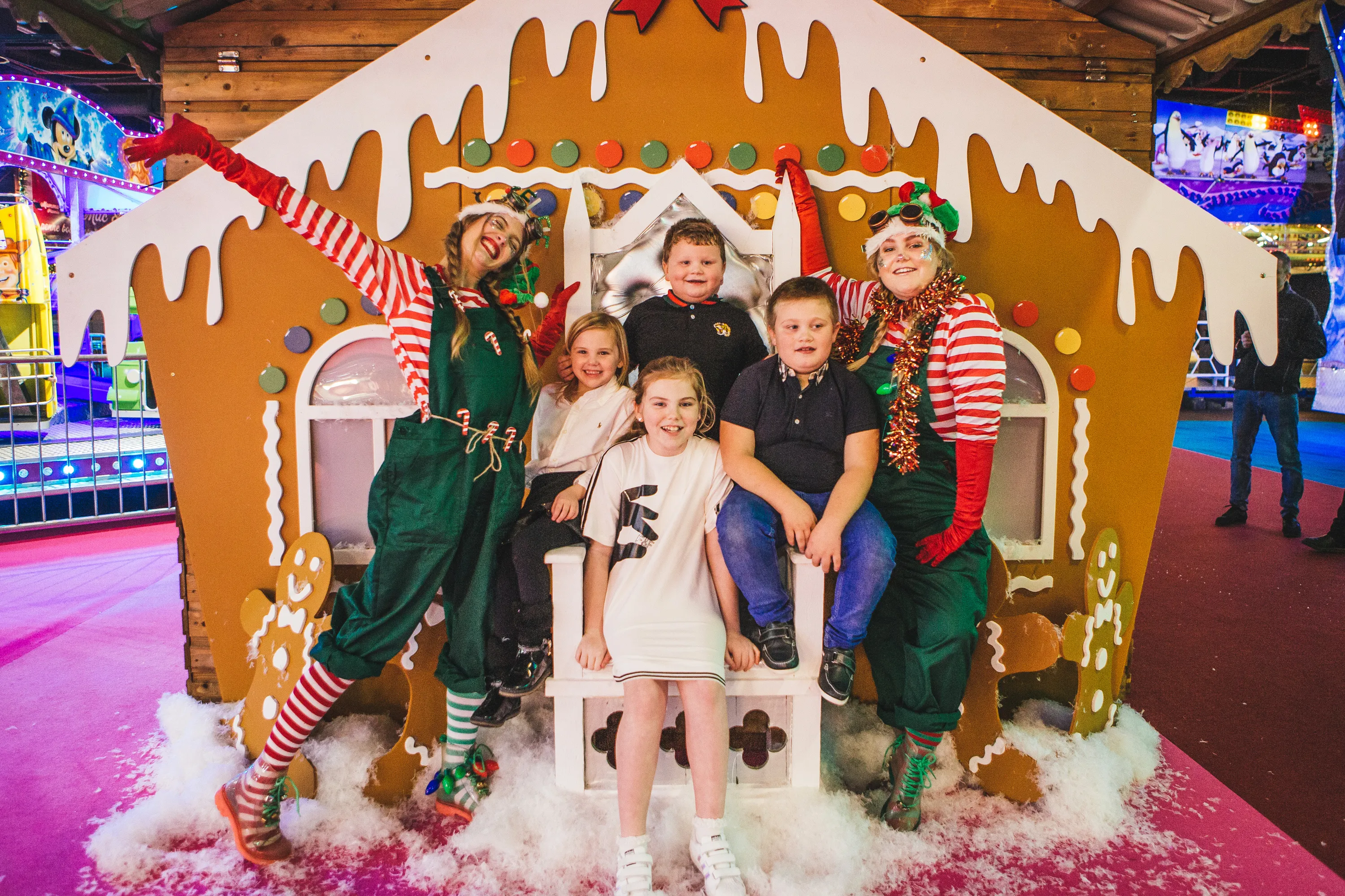 Children at Winter Funland's gingerbread house
