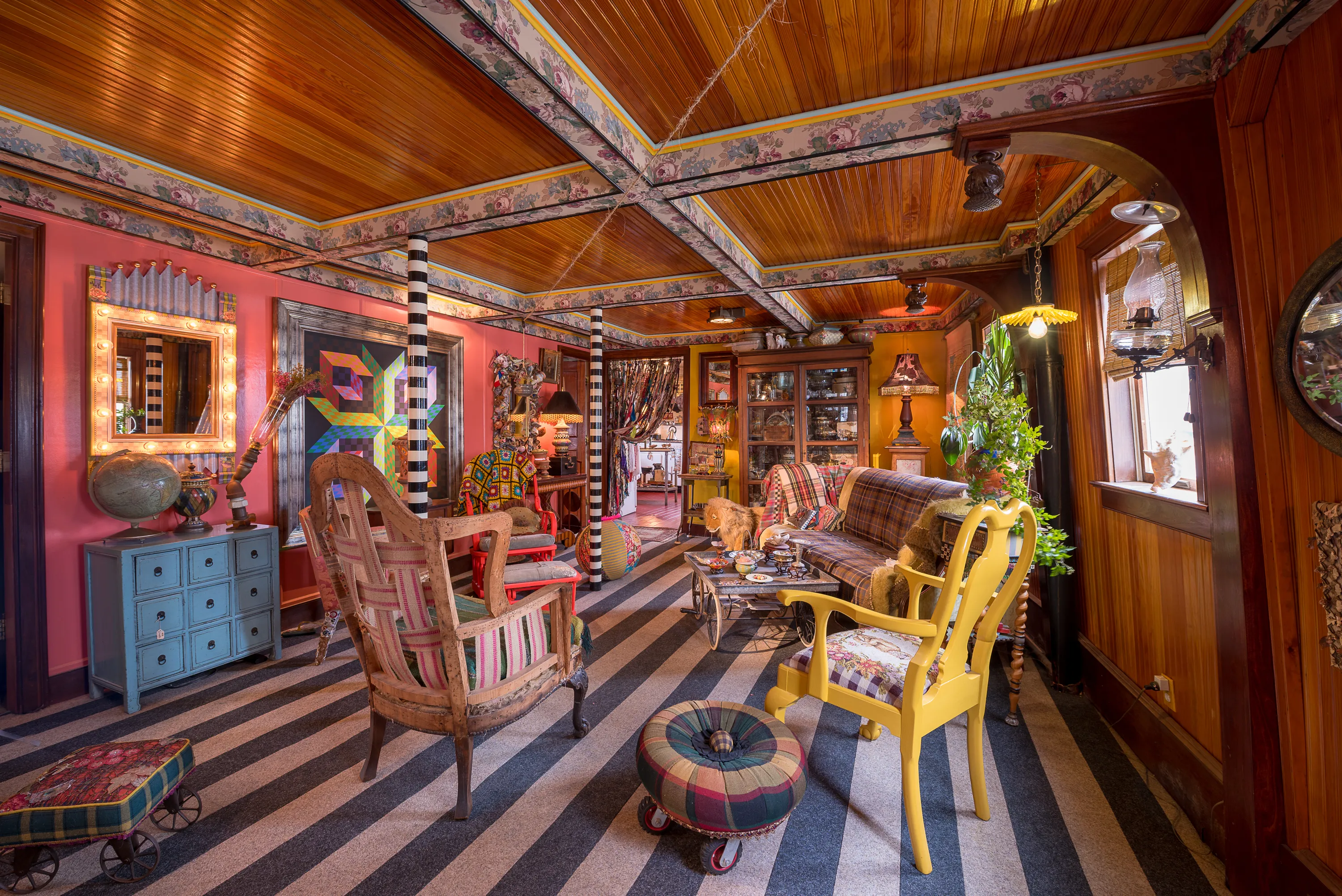 The inside of a ferry boat, meticulously decorated with antique items.