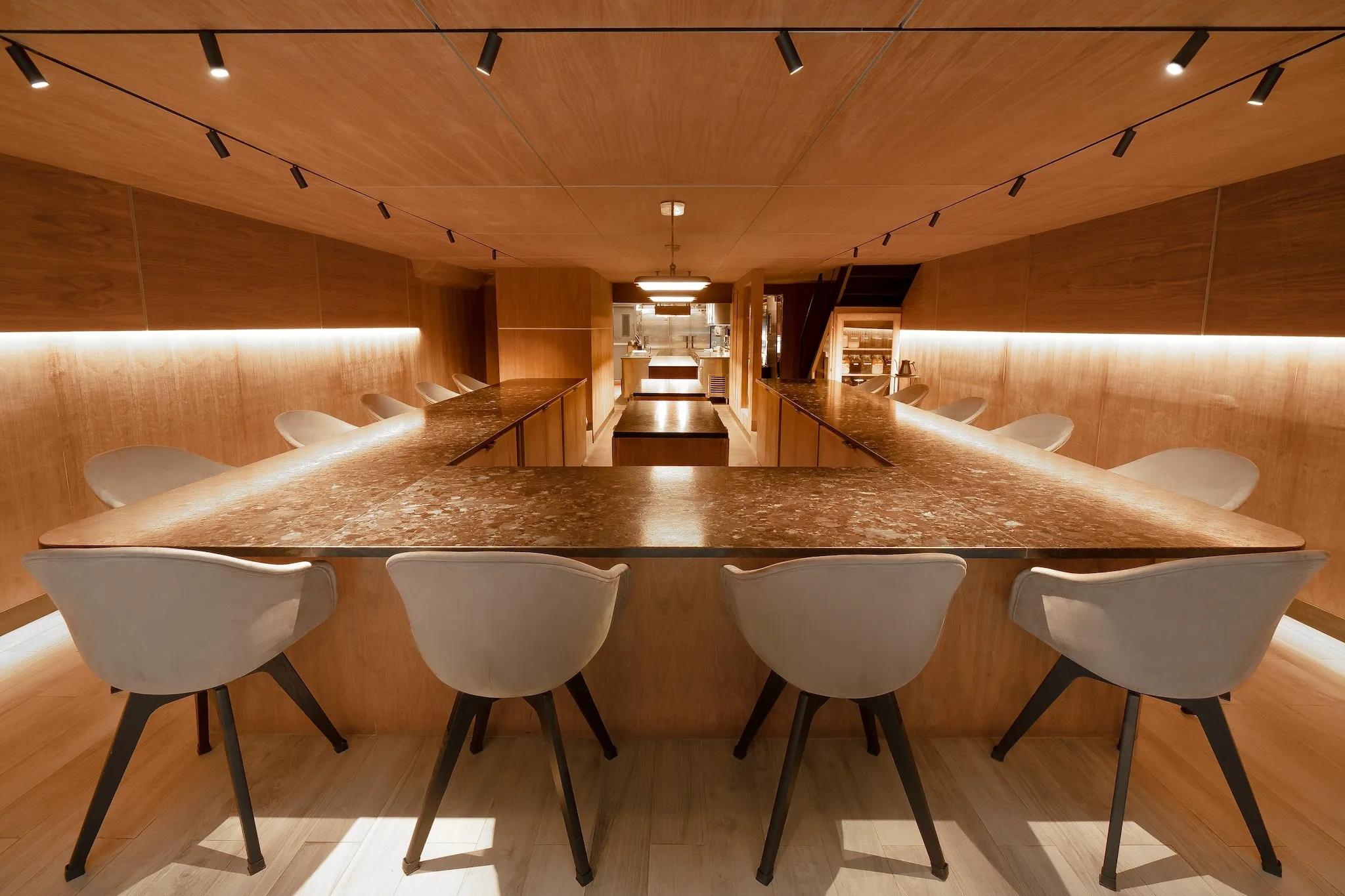 Wooden walls and a marble counter at Atomix